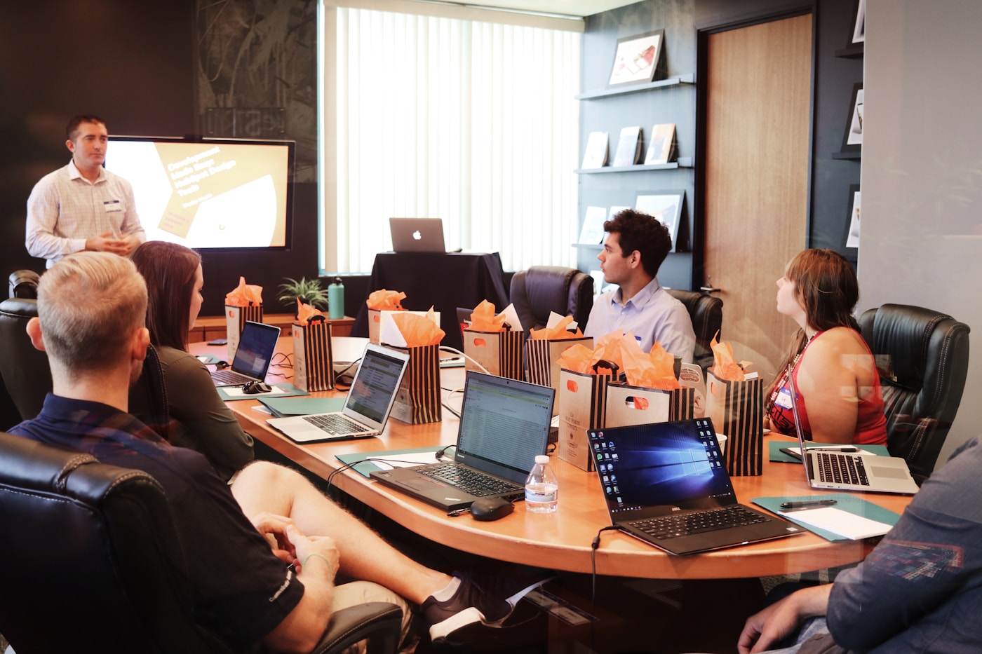Team reviewing plans around a conference table
